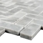 Close-up of Bardiglio Herringbone Polished Marble Mosaic Tile edges showing the gray color and smooth polished finish.