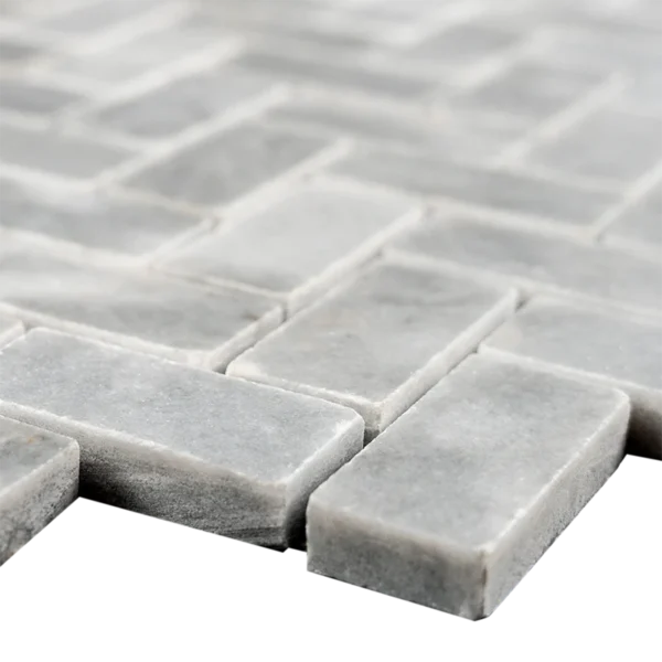 Close-up of Bardiglio Herringbone Polished Marble Mosaic Tile edges showing the gray color and smooth polished finish.
