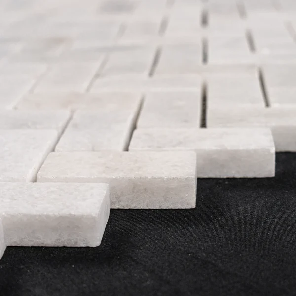 Milas Herringbone 1x2 Honed Mosaic Tile – Close-up view of the white marble herringbone mosaic, showcasing subtle veining and a smooth honed finish.