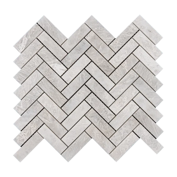 Detailed view of Iceberg Herringbone 1x3 mosaic tiles, showing the natural veining of the white marble and its reflective polished surface.