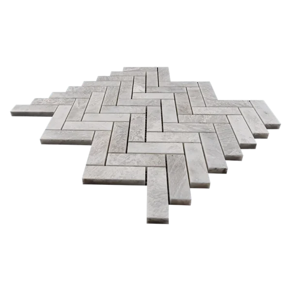 Close-up of Iceberg Herringbone polished 1x3 marble mosaic, emphasizing the bright, reflective surface and the intricate veining that adds luxury to any space.