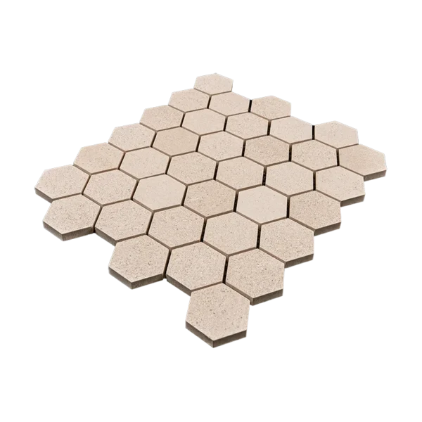 Angled view of 2-inch honed limestone honeycomb mosaic tile sheet showing hexagon shape and soft beige tones.