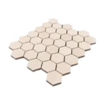 Top view of 2-inch honed limestone honeycomb mosaic tile sheet in soft beige with hexagon layout for bathroom and backsplash use.