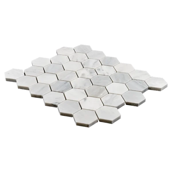 Angled view of 2-inch honed Carrara White marble honeycomb mosaic tile sheet with white hexagon pieces.