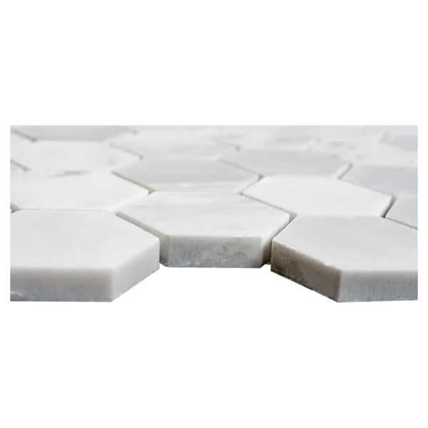 Side view of 2-inch honed Carrara White marble honeycomb mosaic tiles showing hexagon shape and thickness.