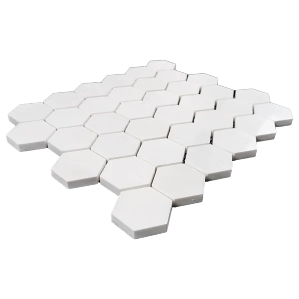 Angled view of polished Dolomite honeycomb tile sheet with 2-inch hexagon pieces