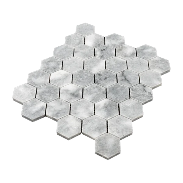 Angled view of Bardiglio grey marble mosaic tile sheet with 2-inch polished hexagonal tiles arranged in a honeycomb layout, featuring soft white veining.