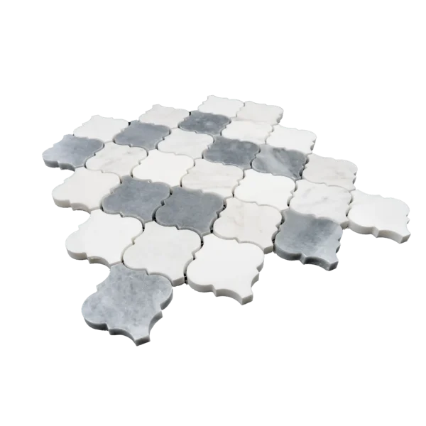 A full sheet of arabesque-shaped marble mosaic tiles in a mix of white and dark gray tones, arranged in an interlocking pattern, showcasing the elegant polished surface and classic design.