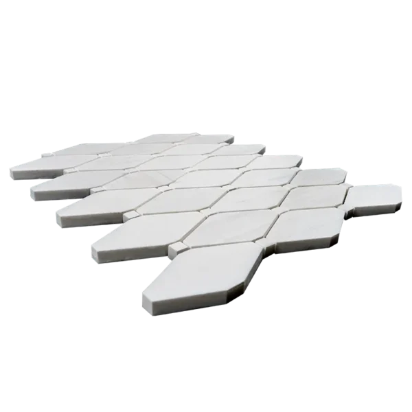 Side view of clipped diamond polished dolomite marble mosaic tile showing thickness and white stone texture