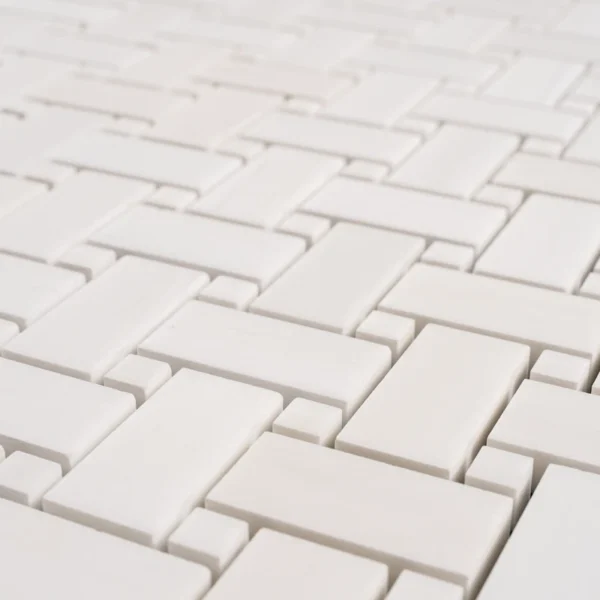 Detailed view of a white Dolomite basketweave mosaic tile, showcasing a polished grid pattern.