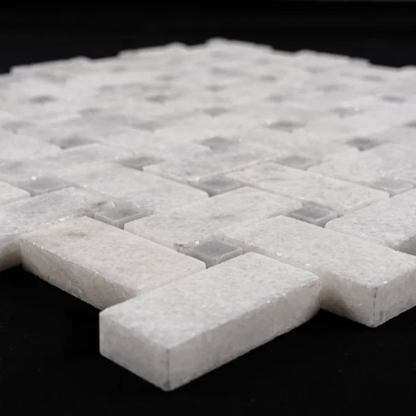 Detailed image of gray honed basketweave mosaic tile with subtle veining and geometric arrangement.