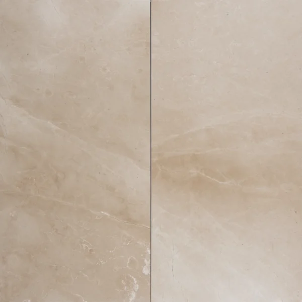 Two Botticino marble tiles with polished finish and subtle veining laid side by side for design preview