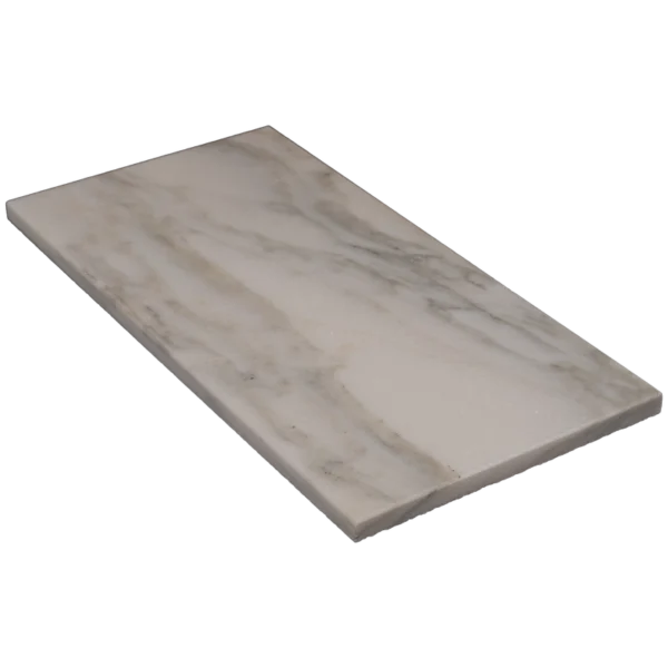 Angled perspective of Calacatta polished marble 6x12 tile with beveled edge detail
