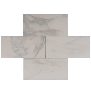 Arrangement of four Calacatta 6"x12" tiles with soft white base and subtle golden-gray veining in honed finish.