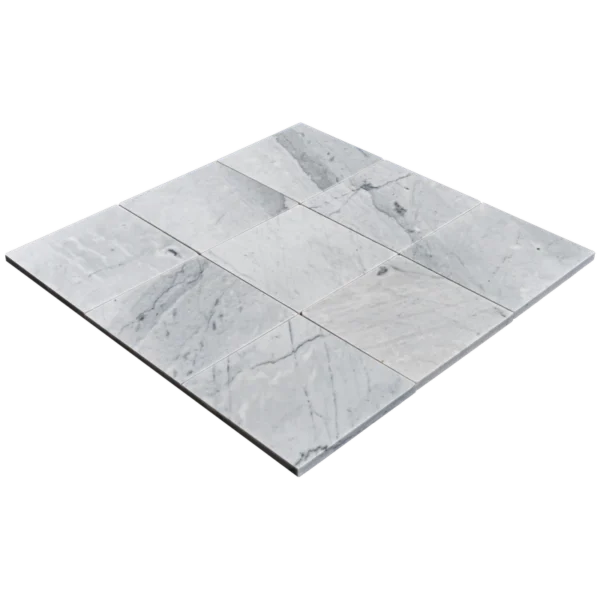 Perspective shot of nine Carrara 6"x6" honed marble tiles arranged in a square layout on a dark background.
