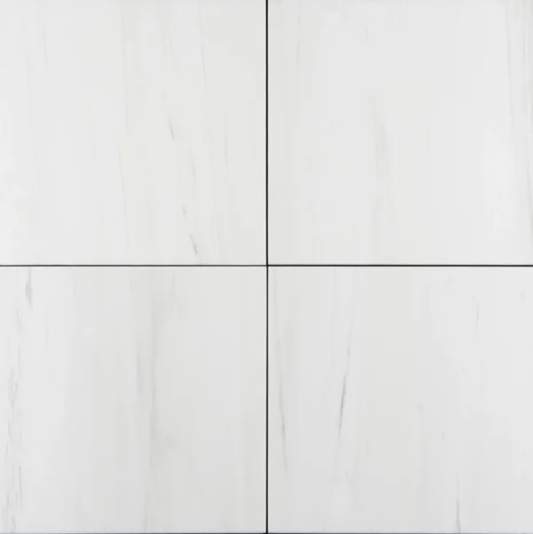 Overhead view of a 12x12 polished Dolomite marble tile showing subtle white background with faint vertical veining.