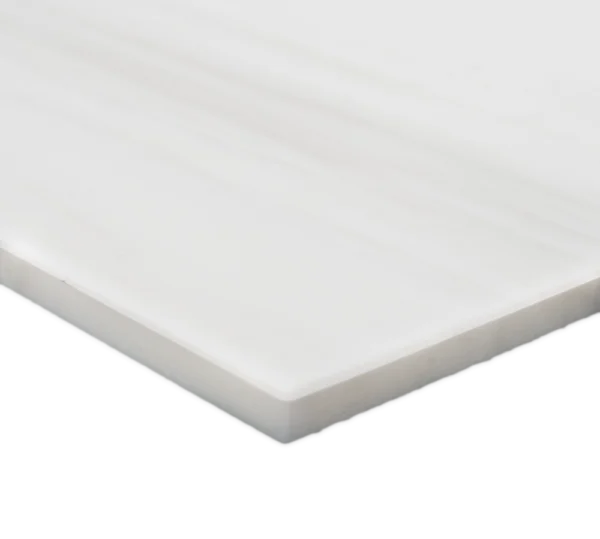 Corner angle view of a Dolomite marble tile showing clean edges, uniform thickness, and a honed matte surface.