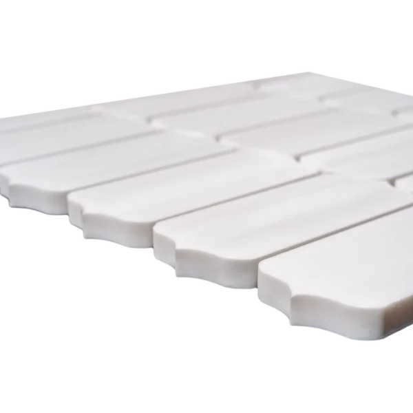 A uniform white dolomite mosaic tile layout with subtle texture and slight natural variation, arranged neatly in rows.