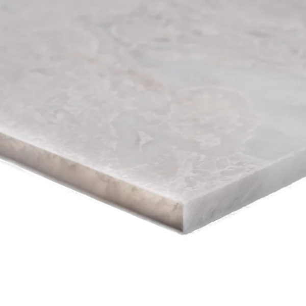 Close-up of the straight edge and honed finish on an Iceberg marble tile