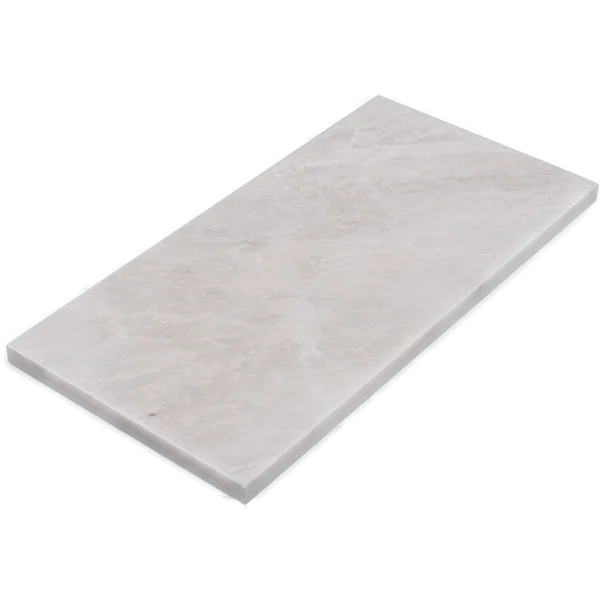 Close-up angled view of Iceberg honed marble tile with beveled edge, 6x12 inch dimension