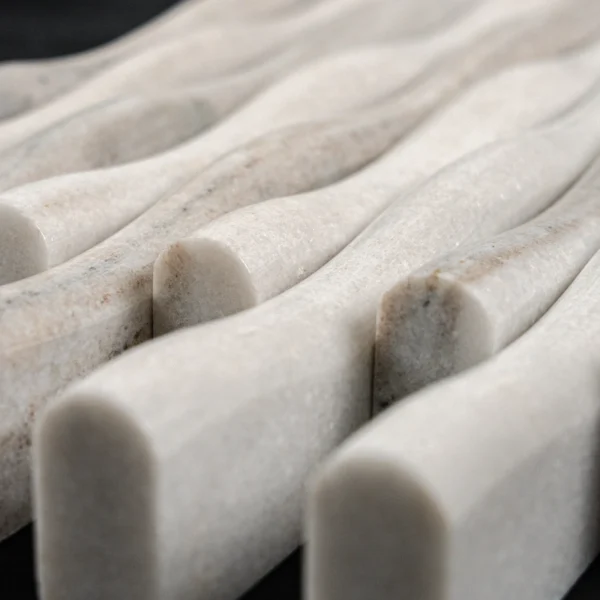Macro perspective emphasizing the varying heights and soft edges of the Lilium Palissandro tile's sculptural linear pattern.