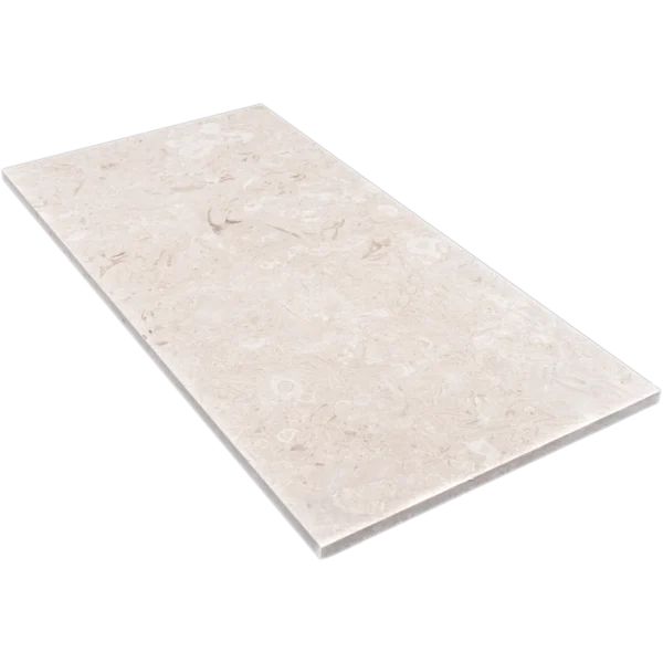 Angled view of Myra Beige limestone tile in 12"x24" size, showcasing its honed finish and natural fossil patterns.