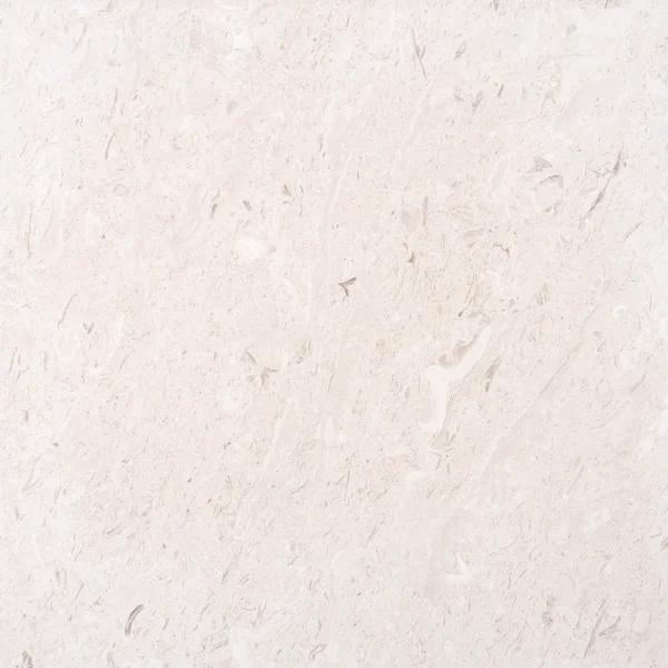 Top view of Myra Beige 24x24 honed limestone tile with soft fossil pattern and natural beige tones