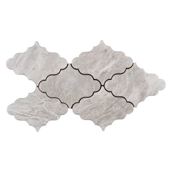 Close-up of white Iceberg marble mosaic tile with delicate veining and polished surface, showing intricate shape design.