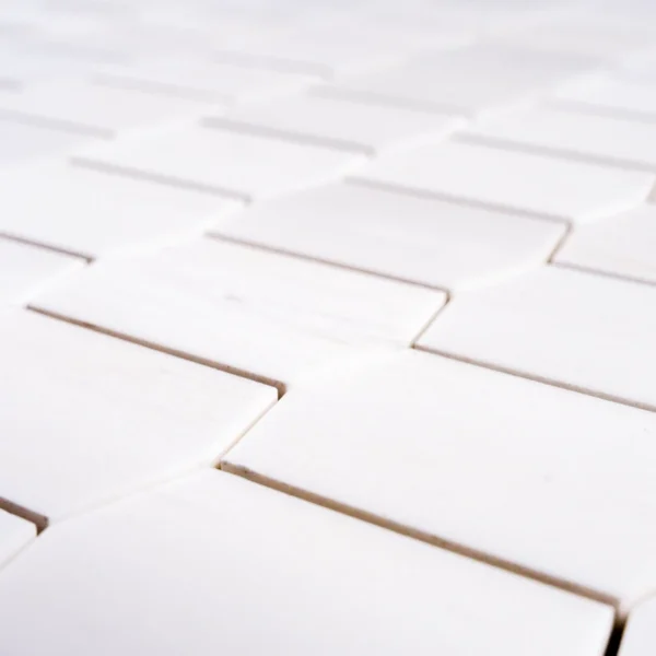 Close-up view of Dolomite Picket Mosaic Tile highlighting its soft white color and honed surface.