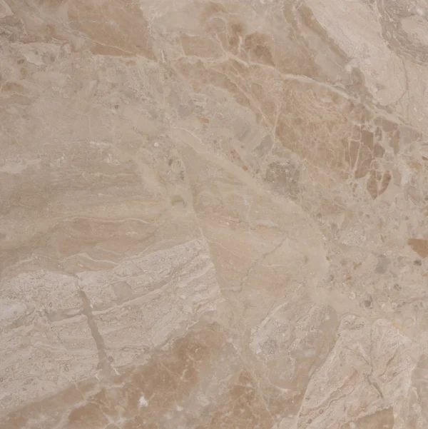 Top view of a honed Royal Beige marble tile showcasing its warm beige tones with dynamic natural veining.
