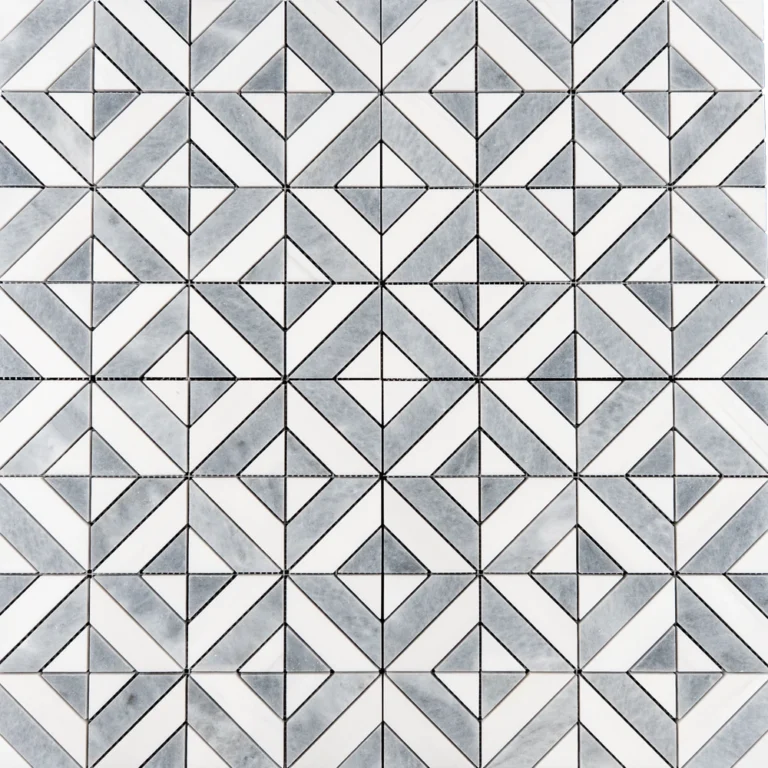 A geometric mosaic tile design in white and gray tones. The tile features a diamond and square pattern formed by small, intricately cut triangular and rectangular pieces.