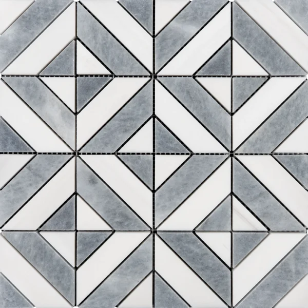 Close-up of the geometric mosaic tile with white and gray pieces forming a symmetrical diamond and square pattern, highlighting the crisp edges and grout lines.