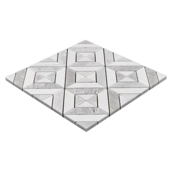 Angled perspective view of a white and light gray geometric marble mosaic tile sheet, displaying the three-dimensional arrangement and thickness of the tiles.
