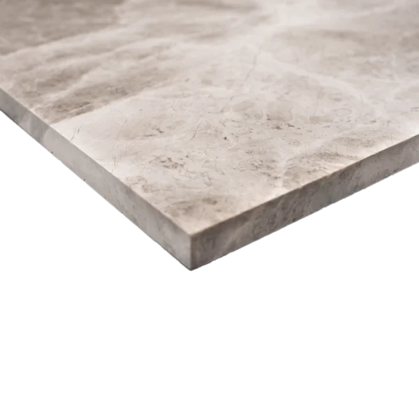 Close-up side view of the Silver Diamond 12"x24" polished marble tile showing its thickness and straight edge.