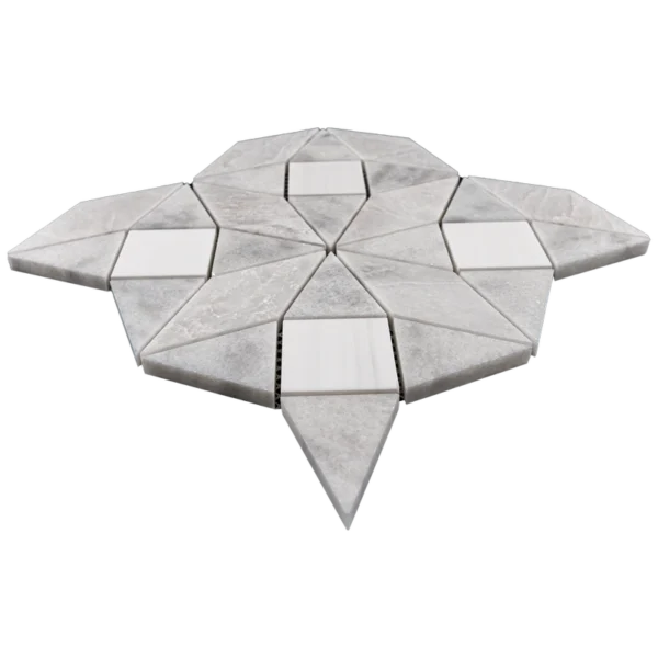 Perspective shot of the Trillium mosaic tile sheet displaying the depth and precision-cut geometry of the triangular and square marble pieces.