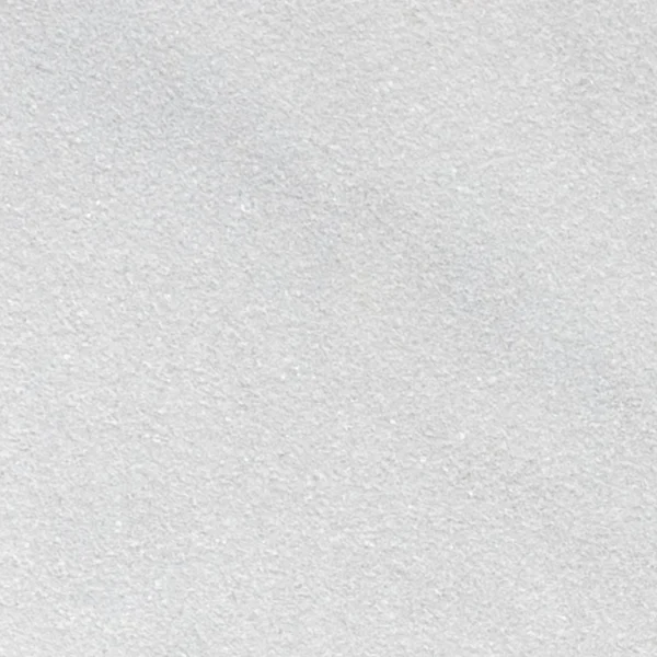Close-up of sandblasted Avalon White 24x24 marble paver with uniform finish