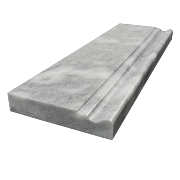 Angled perspective of Bardiglio marble baseboard showing the sculpted profile and polished edge