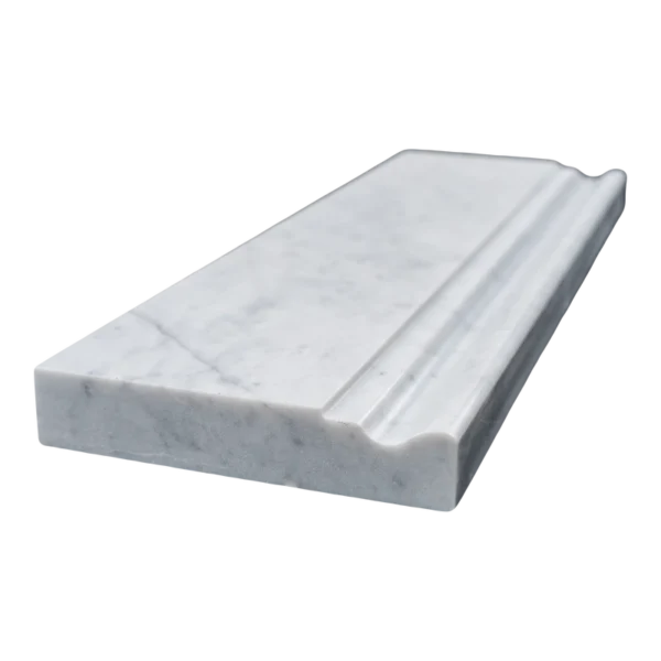 Angled side view of Carrara baseboard tile showing its depth and polished bullnose edge.