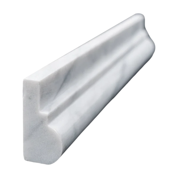Close-up side view of Carrara marble chair rail trim showcasing its polished finish and soft white veining.