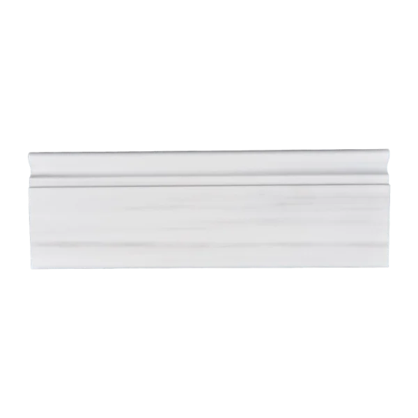 Front view of Dolomite baseboard trim in honed finish with soft white background and linear veining
