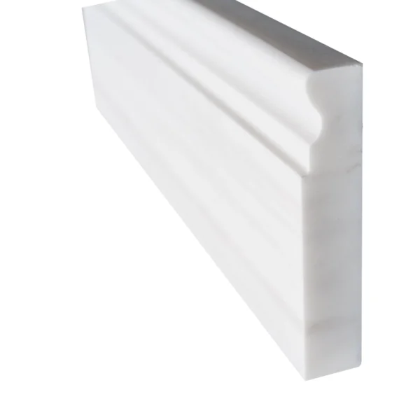 Side view showcasing thickness and honed texture of Dolomite marble baseboard