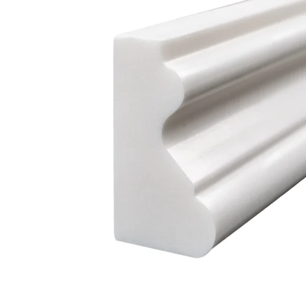 Close-up end view of Dolomite polished crown molding highlighting the intricate trim detail and white marble texture.
