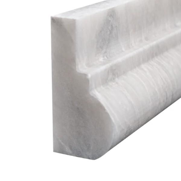 Detailed view of chair rail profile Iceberg marble chair rail with polished surface and refined veining.