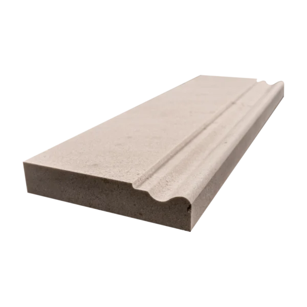Perspective image of limestone baseboard trim illustrating material depth and natural surface finish.
