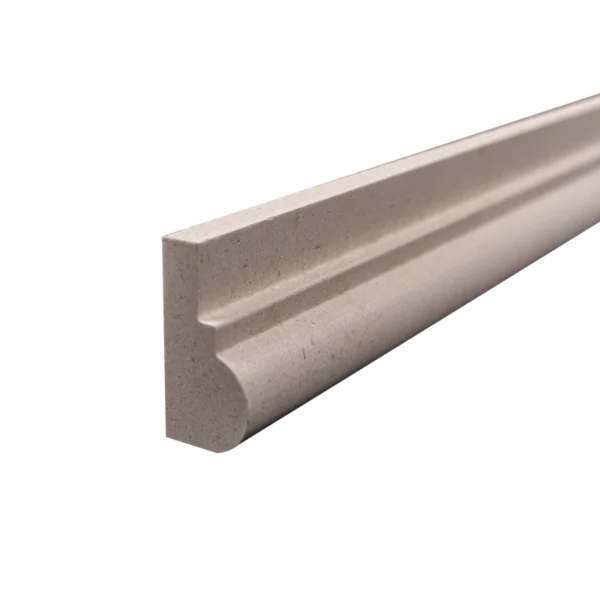 Close-up angle of honed chair rail in natural limestone highlighting craftsmanship and material quality