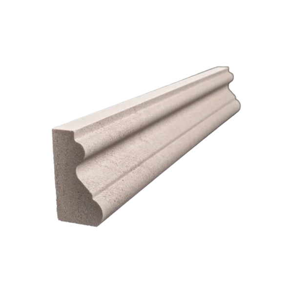 Side view of honed beige limestone crown molding showing intricate shape and matte texture.