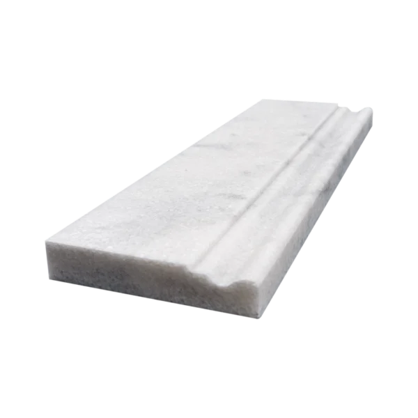 Angled view of honed Milas white marble baseboard showing light grey veining.