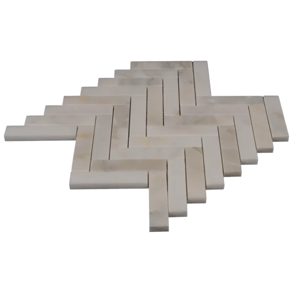 Stacked 1x4 Calacatta marble herringbone mosaic with honed finish, showing thickness and edge details.