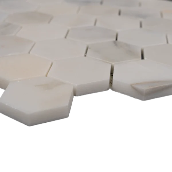 Side profile of Calacatta 2 inch honeycomb honed marble mosaic tile showing thickness and clean edges.