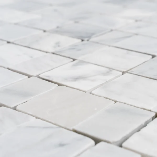 Carrara White Pixel honed marble mosaic — close-up showing smooth honed finish and subtle gray veining.